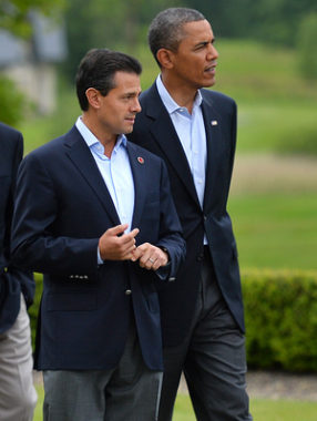 New reports allege that the NSA spied on Mexican President Enrique Pena Nieto, seen here walking with President Barack Obama in June, when he was a candidate for office. Mexico and Brazil have demanded a response to charges of U.S. spying on their internal affairs. Ben Stansall/AFP/Getty Images