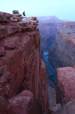 A hiker gazes 3,000 feet down to the Colorado River at Toroweap Overlook in Grand Canyon National Park. A parks advocacy group says the Grand Canyon region has lost 120,000 visitors and $11 million in visitor spending since the government shutdown began. Courtesy of Wanda Gayle