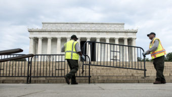 Members of the U.S. Park Service place barricades around the Lincoln Memorial on Tuesday in Washington, D.C. A partial shutdown of the federal government has led to the closing of national parks. Brendan Smialowski/AFP/Getty Images