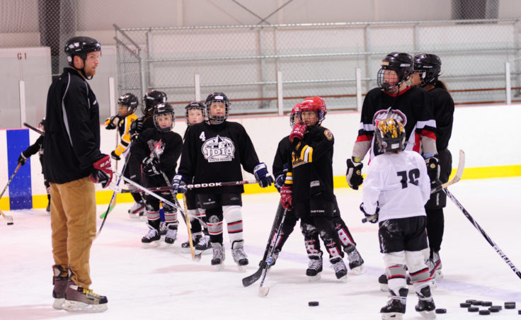 JDIA Coach Matt Boline prepares a group of 25 skaters for their next drill. The camp attracted players ages 5-18.