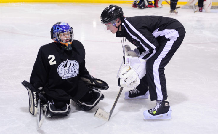 Goaltender coach Heather Strickland works with Anna Dale during JDIA’s skills development camp that attracted nine goalies.