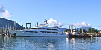 A visiting yacht, complete with its own helicopter, tied up in Petersburg’s South Harbor. Photo by Carey Case.