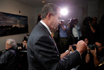 Speaker of the House John Boehner pumps his fist after leaving a meeting of House Republicans at the U.S. Capitol on Wednesday. Win McNamee/Getty Images