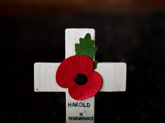 A cross adorned with a poppy was among the ways Harold Percival was remembered Monday. Poppies have been a symbol of remembrance for veterans since the poem In Flanders Fields was written in 1915 by a Canadian military doctor. Nigel Roddis/Getty Images