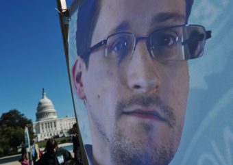 An image of Edward Snowden on the back of a banner is seen infront of the U.S. Capitol during a protest against government surveillance on October 26, 2013 in Washington, D.C. Mandel Ngan /AFP/Getty Images