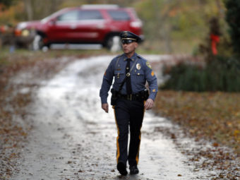 Police gather at a home belonging to the father of LA airport shooting suspect Paul Ciancia in Pennsville N.J. on Friday. Joseph Kaczmarek/AP