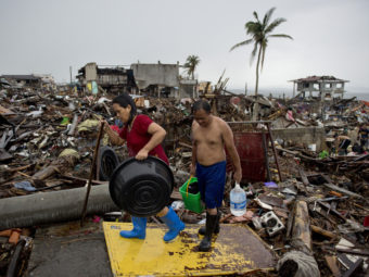 Friday in Tacloban, the Philippines, survivors continued to sift through the rubble. Odd Andersen /AFP/Getty Images