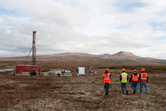 Members of the media walking to an exploratory drill rig. Photo by Jason Sear, KDLG – Dillingham