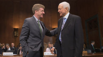 Former Rep. Patrick Kennedy (left) is welcomed by Sen. Orrin Hatch, R-Utah, during a hearing about mental health parity rules Thursday. A new rule issued by the Obama administration aims to increase parity for how insurers handle mental health issues. Chip Somodevilla/Getty Images