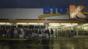 Kmart's plan to be open for 41 straight hours beginning at 6 a.m. Thanksgiving morning is drawing criticism. At this Kmart store in Connecticut, shoppers wait in line to take advantage of sales on Thanksgiving Day. Douglas Healey/AP