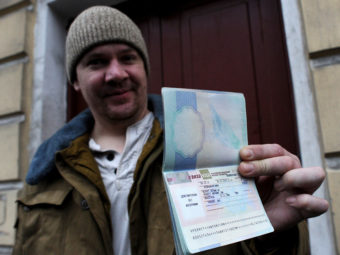In St. Petersburg on Thursday, Greenpeace International activist Anthony Perrett, a British citizen, showed the Russian transit visa that's now in his passport. (Olga Maltseva/AFP/Getty Images)