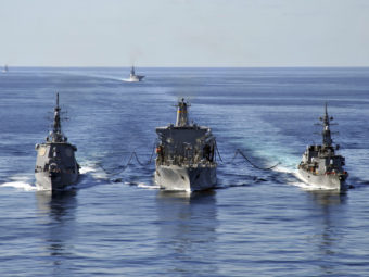In this Dec. 5, 2010 file photo released by U.S. Navy, USNS Tippecanoe, center, refuels Japan Maritime Self-Defense Force Escort Flotilla ships Ikazuchi, right, and Kongo during a joint military exercise in the Pacific Ocean. Charles Oki/AP