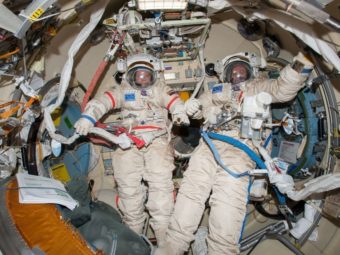 Commander Oleg Kotov (left) and Sergey Ryanzansky, preparing for a spacewalk aboard the ISS on Nov. 9. NASA