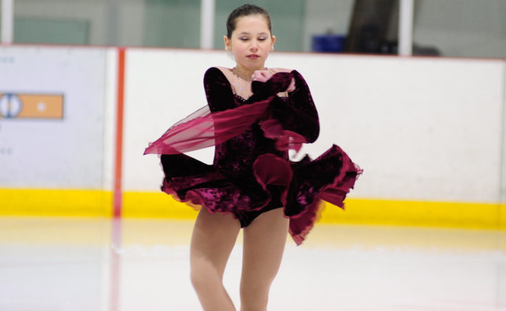Olivia Gardner performs while Joy to the World plays during Juneau Skating Club’s annual holiday recital.