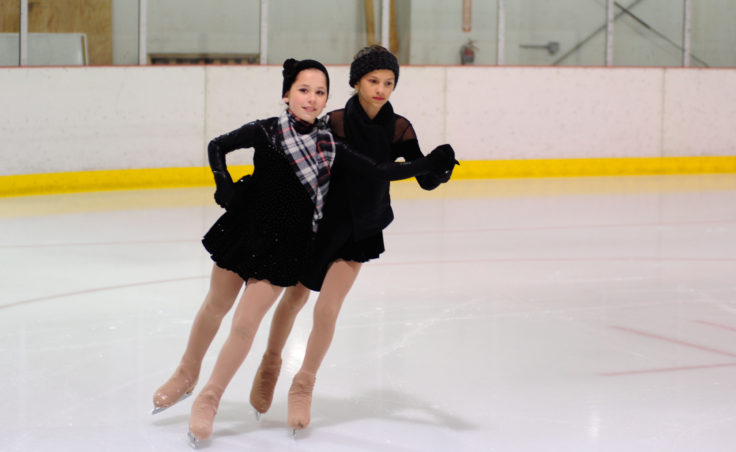 (From Left) Olivia Gardner and Megan Renkes team up during a final group performance skated to It’s beginning to look a lot like Christmas.