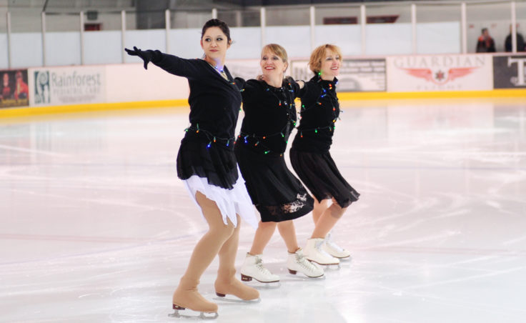 (From left) Skating instructors Maggie Frank, Sigrid Dahlberg and Wendy Vuille link up during an opening number featuring all performers dancing to Jingle Bell Rock.