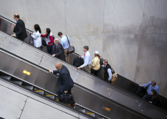 People exit a Metro subway station, by escalator, along Pennsylvania Ave., NW, in Washington. Cliff Owen/AP