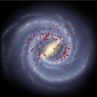 An image showing the distribution of massive stars in the new study. Our location within the Galaxy is circled in black. J. Urquhart et al./Background image by Robert Hurt of the Spitzer Science Center.