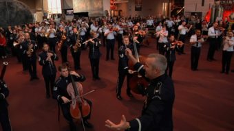 Col. Larry H. Lang conducts the Band's first-ever flash mob at the National Air and Space Museum on Dec. 3. U.S. Air Force