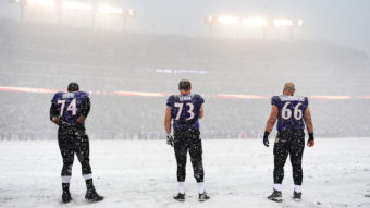 A winter storm is hitting an area from Virginia to New England, snarling traffic and closing schools. On Sunday, heavy snowfall changed the look of an NFL game in Baltimore, Md., where Ravens players stood for the national anthem at 1 p.m. Patrick Smith/Getty Images
