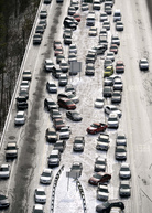 Abandoned cars sit on Interstate 75 in Atlanta. Traffic halted Tuesday during an ice and snow storm. Two days later, drivers can start retrieving their vehicles. David Tulis/AP