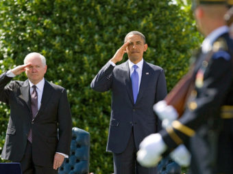 Defense Secretary Robert Gates and President Obama salute during a farewell ceremony for Gates on June 30, 2011. Evan Vucci/AP