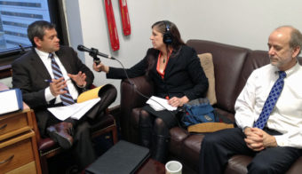 APRN's Lori Townsend speaks with Chris Tuck and Hollis French. (Photo by Annie Feidt/APRN)