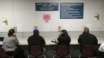 The lines were busy last September at an unemployment insurance phone bank operated by the California Employment Development Department in Sacramento. Rich Pedroncelli/AP