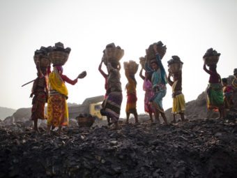 Local villagers scavenging coal illegally from an open-cast mine in a village near Jharia, India, in 2012. Daniel Berehulak/Getty Images