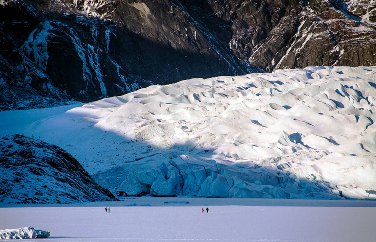 People on the ice in front of Mendenhall Glacier. (Photo by Heather Bryant / KTOO)