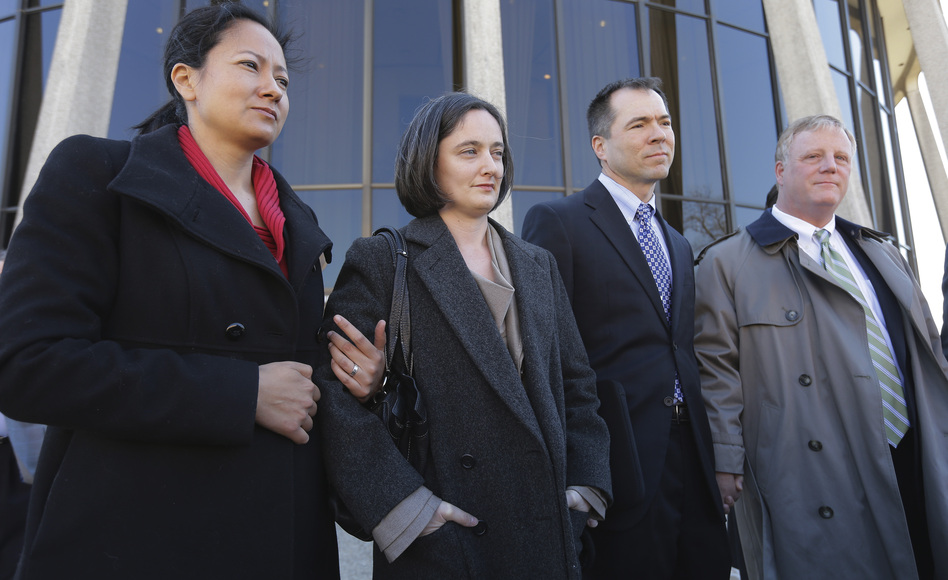 Couples Cleopatra De Leon and Nicole Dimetman and Victor Holmes and Mark Phariss speak with reporters outside the U.S. Federal Courthouse in San Antonio earlier this month. The judge in their case ruled Texas' ban on gay marriage unconstitutional Wednesday. Eric Gay/AP