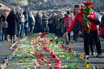 In Kiev's Independence Square, flowers have been left in memory of protesters killed there in recent days. Jeff J Mitchell/Getty Images