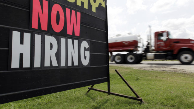 As the weather warms, while more signs such as this pop up? Economists say the latest data on claims for unemployment benefits may signal that better times are ahead. (Eric Gay/AP)