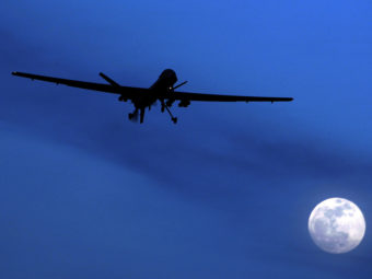 A U.S. drone in the sky over Kandahar Air Field in Afghanistan. Kirsty Wigglesworth/AP