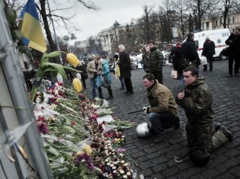 Praying for those who died: Mourners were in Kiev's Independence Square again on Tuesday. It was the site of protests in recent months, and was where more than 80 people died last week in violence blamed on security forces. Louisa Gouliamaki /AFP/Getty Images