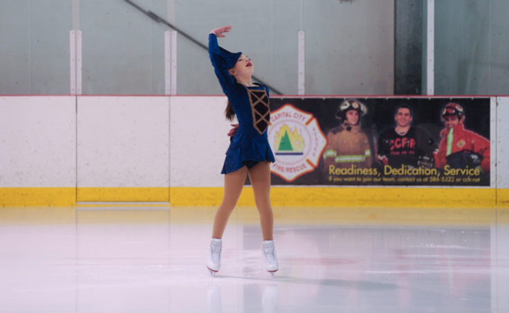 Kara Hort punctuates her performance by striking this final pose during her routine at Treadwell Ice Arena.