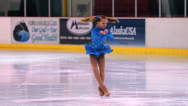 Tessa Murphy’s pig tails go flying as she spins during the Free Skate 1 competition category.
