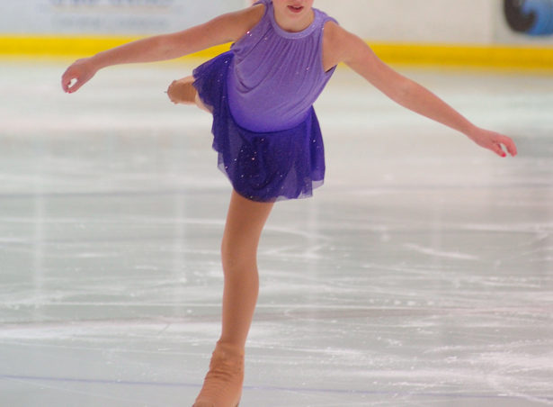 Sadie Murphy balances on a single blade in the Free Skate 2 competition at Treadwell Ice Arena.