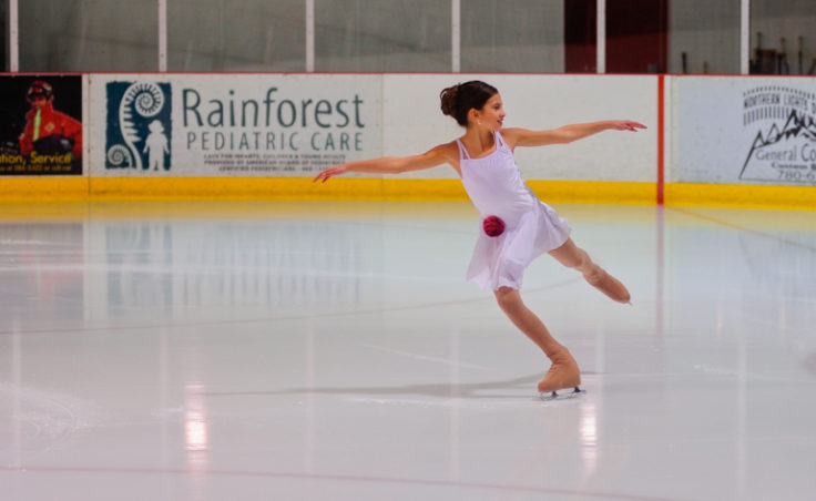 Megan Renkes glides while kicking off the events titled well-balanced at Treadwell Ice Arena.