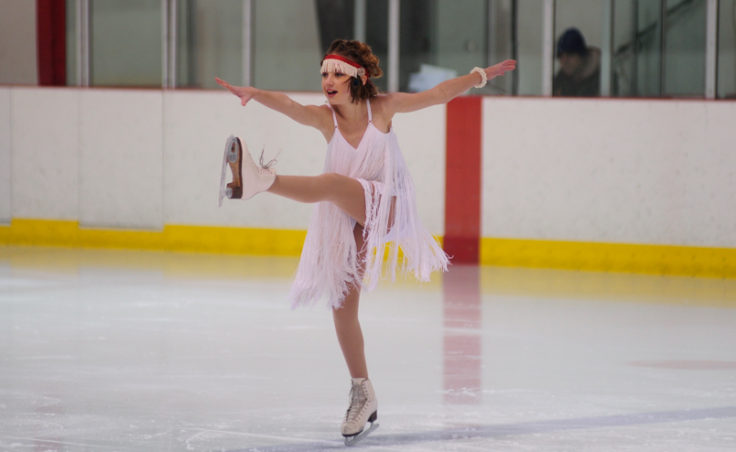 Grace Walli does a kick while balancing on the skate’s jagged toe pick during her performance.