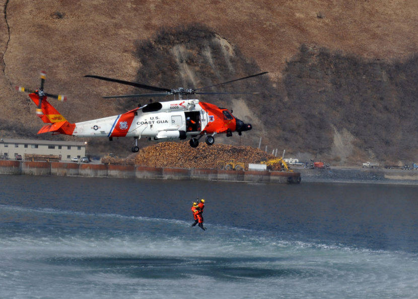 MH-60 Jayhawk helicopter crews perform a search and rescue demonstration off the back of the Coast Guard Cutter Munro April 15, 2013, in Womens Bay, Kodiak, Alaska. (U.S. Coast Guard photo by Petty Officer 3rd Class Jonathan Klingenberg.)