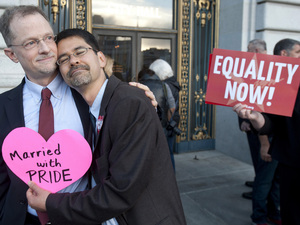 John Lewis (left) and Stuart Gaffney embrace outside San Francisco's City Hall shortly before the U.S. Supreme Court ruling cleared the way for same-sex marriage in California in June. Noah Berger/AP