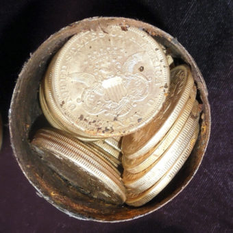 Thar's gold in them thar cans: One of the eight cans discovered by a California couple. They were stuffed with gold coins minted in the 1800s. The cache's estimated value: $10 million. Kagin's Inc./AP