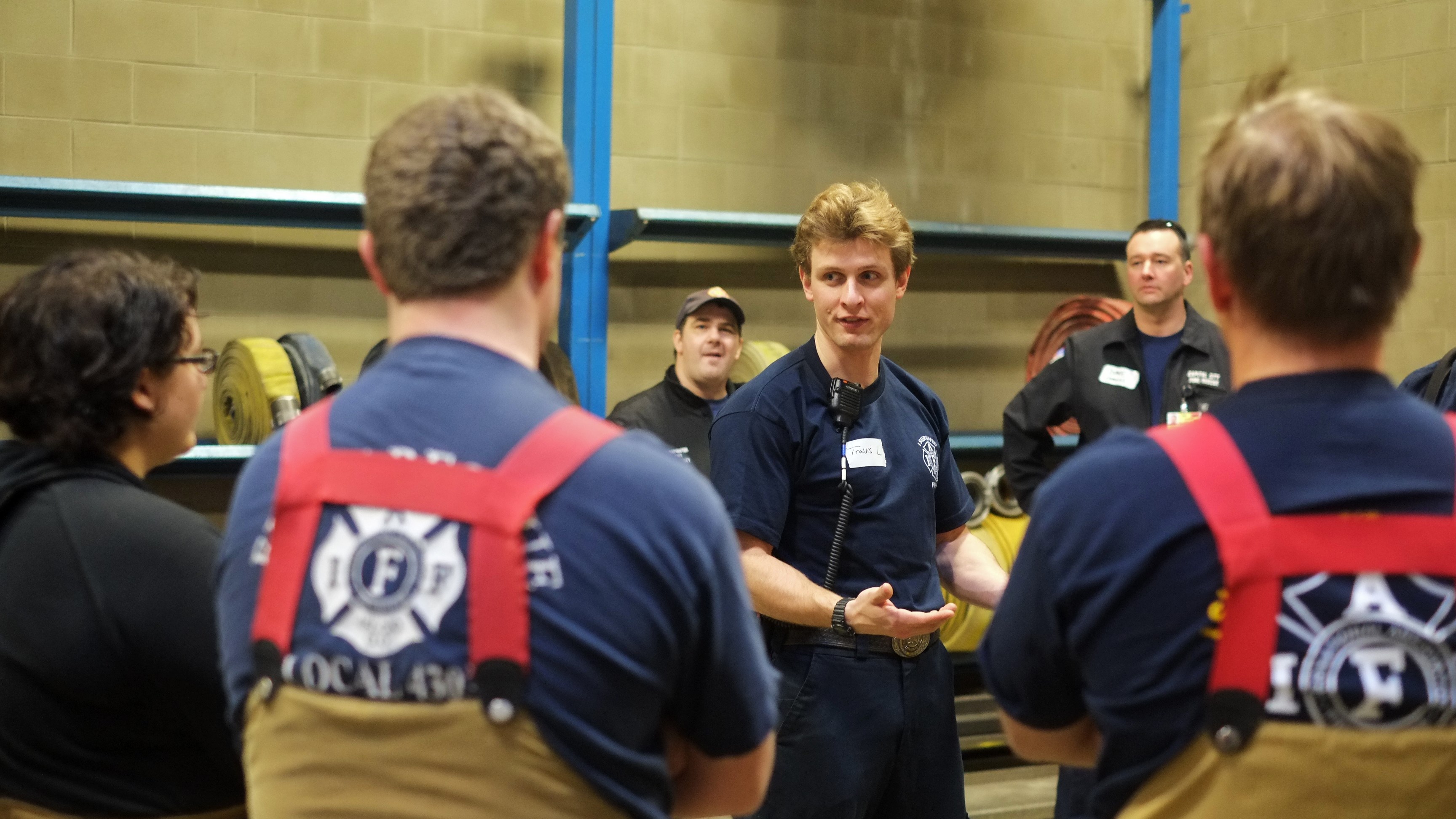EMT Travis Larsen briefs participants on the CPR training at Hagevig Fire Training Center. (Photo by Annie Bartholomew/KTOO)