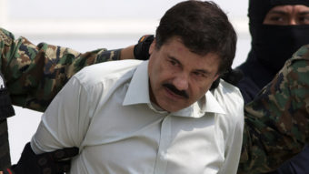 Joaquin "El Chapo" Guzman is escorted to a helicopter in handcuffs by Mexican navy marines at a navy hanger in Mexico City on Saturday. A senior U.S. law enforcement official said that Guzman, the head of Mexico's Sinaloa Cartel, was captured alive overnight in the beach resort town of Mazatlan. Eduardo Verdugo/AP
