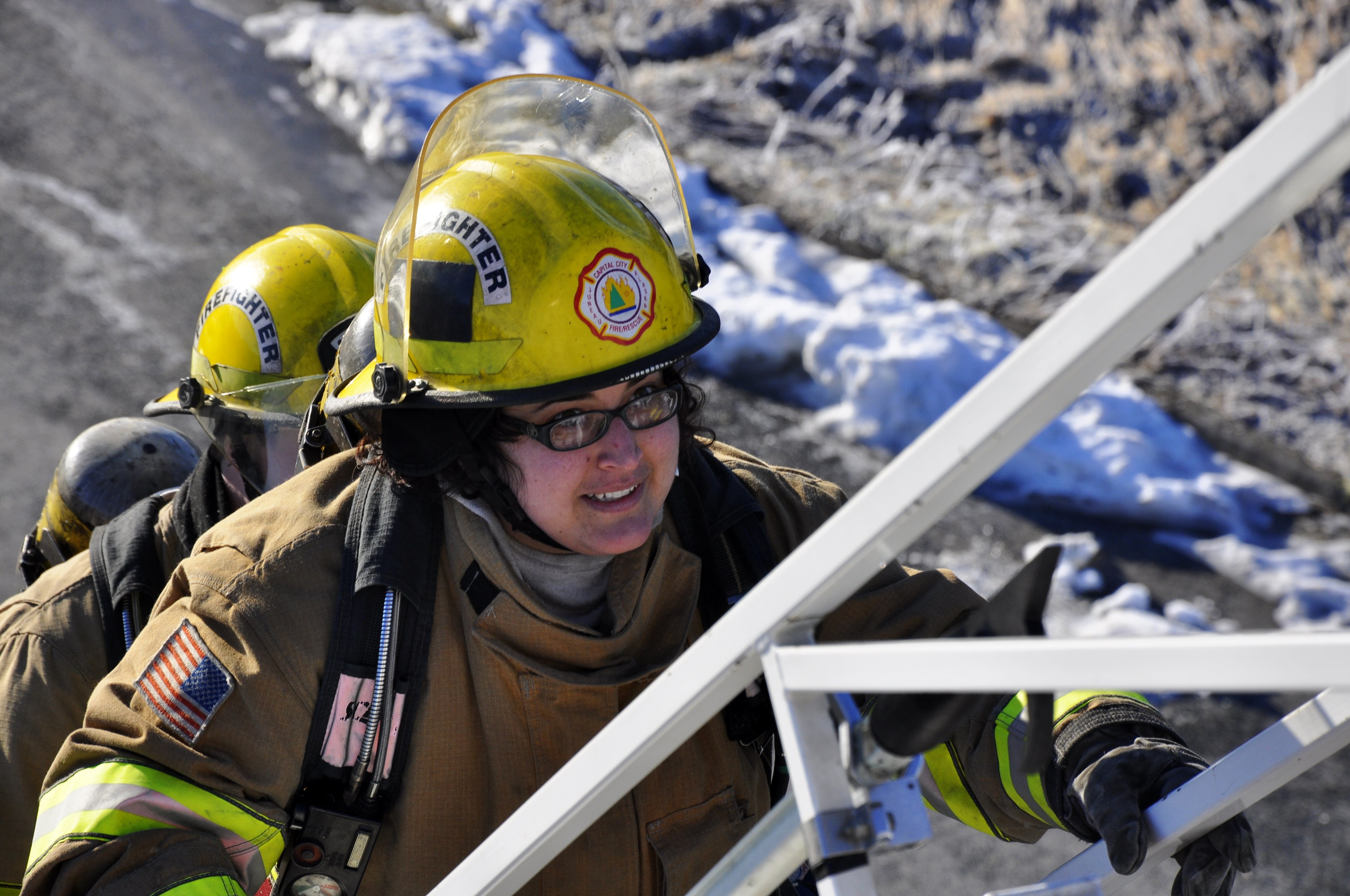 Juneau Empire reporter Emily Russo Miller climbs to the top of the ladder at the Hagevig Fire Training Center. Photo by Annie Bartholomew/KTOO