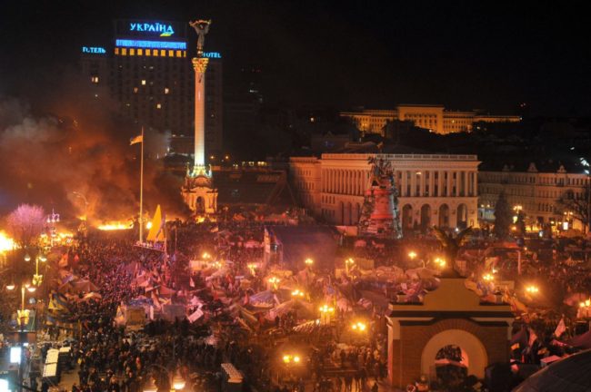 Anti-government protesters clash with the police during their storming of Independence Square in Kiev. The Associated Press reported police dismantled barricades on the perimeter of the square and set some of the protesters' tents on fire. Genya Savilov/AFP/Getty Images