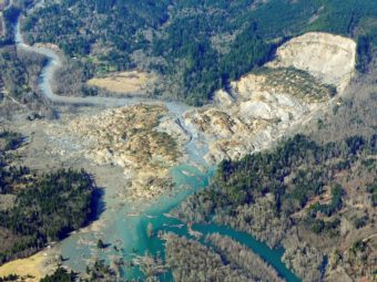 The massive mudslide that killed at least eight people and left dozens missing is shown in this aerial photo, on Monday, near Arlington, Wash. Ted S. Warren/AP
