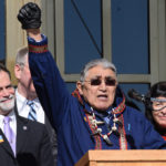 Rep. Benjamin Nageak raises his fist in solidarity with the effort to reduce domestic violence in Alaska at the Choose Respect rally on the Capitol steps, March 27, 2014. (Photo by Skip Gray/KTOO)