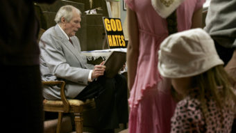Westboro Baptist Church founder Fred Phelps' followers believe "they're not going to feel the sting of death," one of his sons says. Phelps, who's now in hospice care, is seen here at the Topeka, Kan., church in 2006. Charlie Riedel/AP